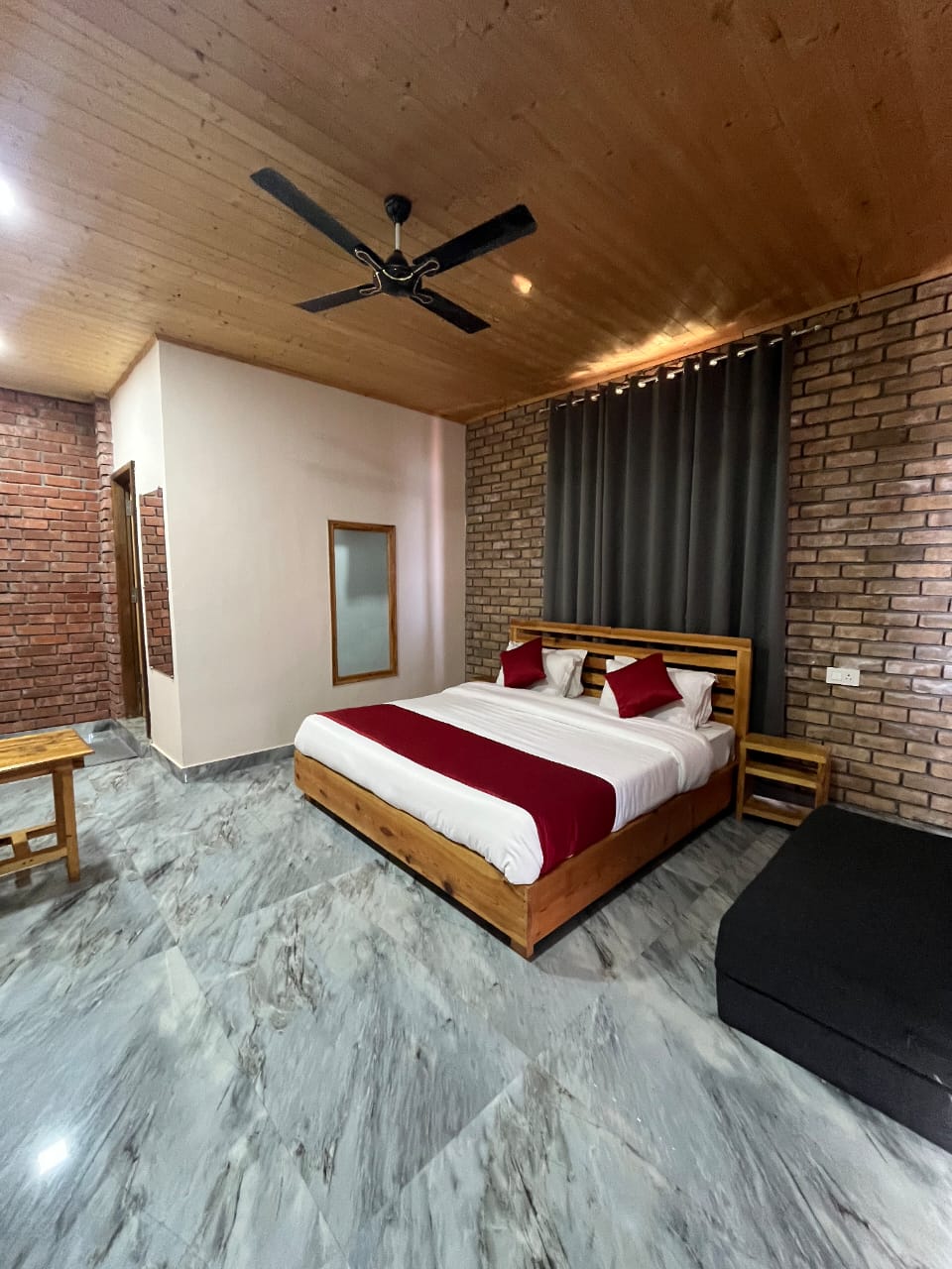 Deluxe room with brick accent